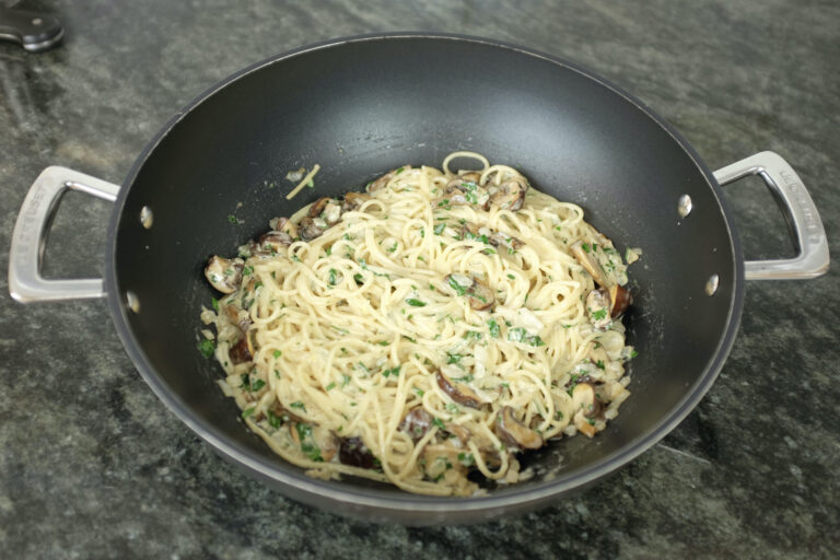 creamy spaghetti pasta with crispy mushrooms parmesan cheese and parsley