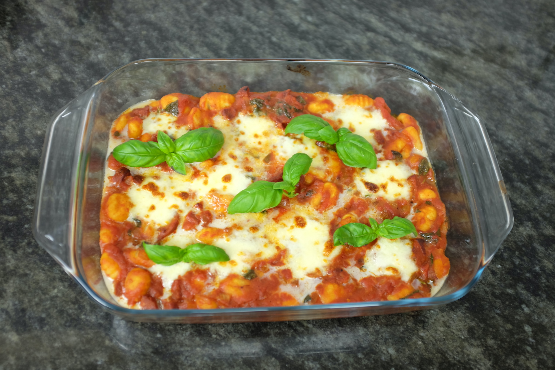 fresh gnocchi with chorizo and mozzarella cheese baked in the oven