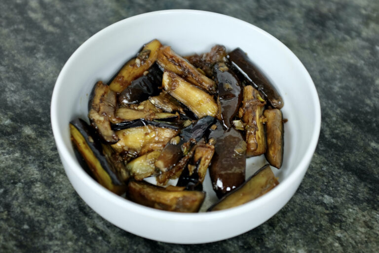 roasted aubergine dish with garlic spring onion and soy sauce with apple cider vinegar