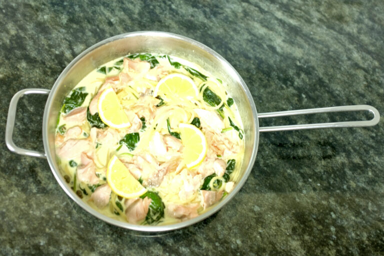 creamy roasted salmon pasta dish with baby spinach capers garlic lemon zest and a splash of white vine