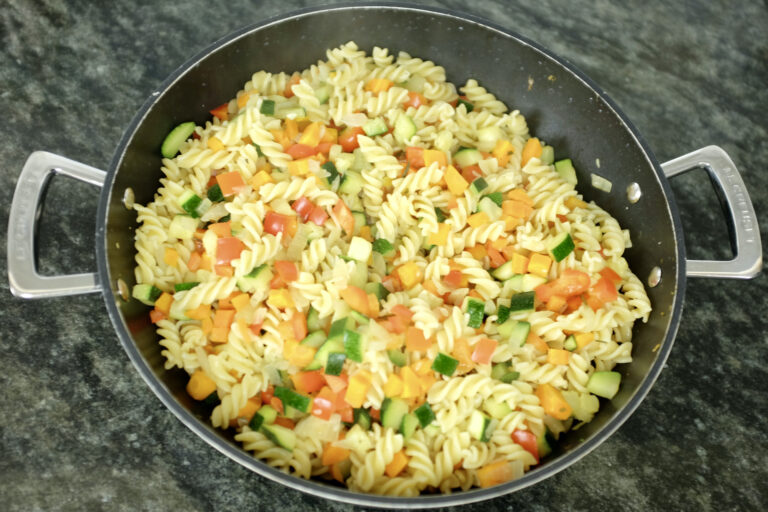 fusilli pasta with red pepper courgette carrot onion and fresh rosemary