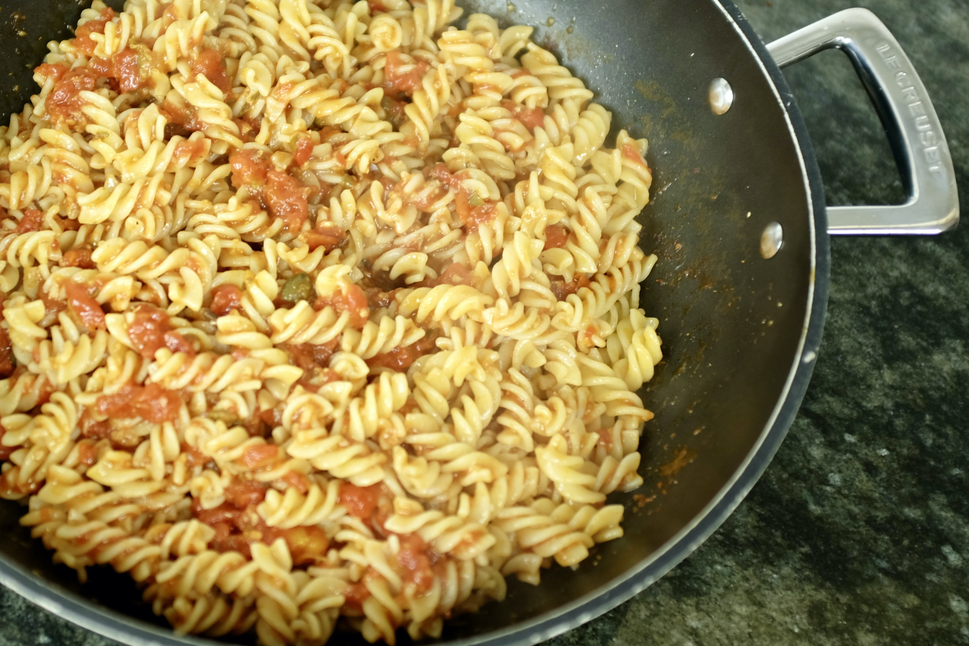 fusilli pasta puttanesca with garlic anchovies capers and canned tomatoes