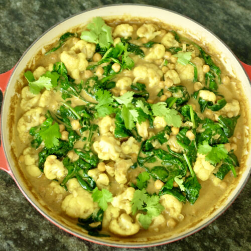 cauliflower chickpea and coconut curry with fresh spinach and ginger