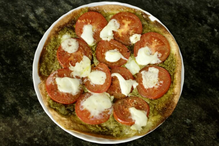 pizza style wrap with pesto verde tomato and mozzarella